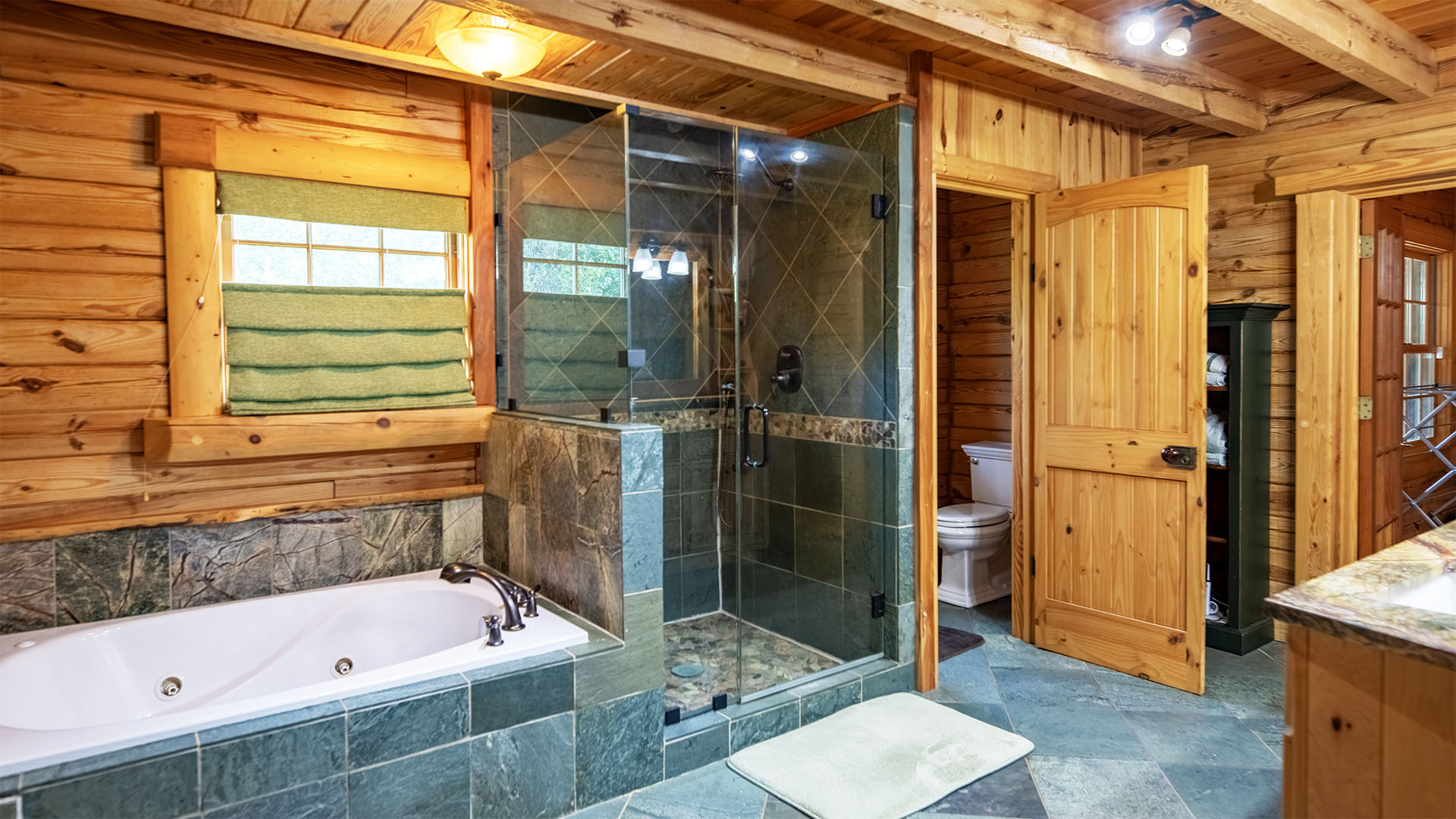 first floor primary bathroom in log home at Virginia horse farm