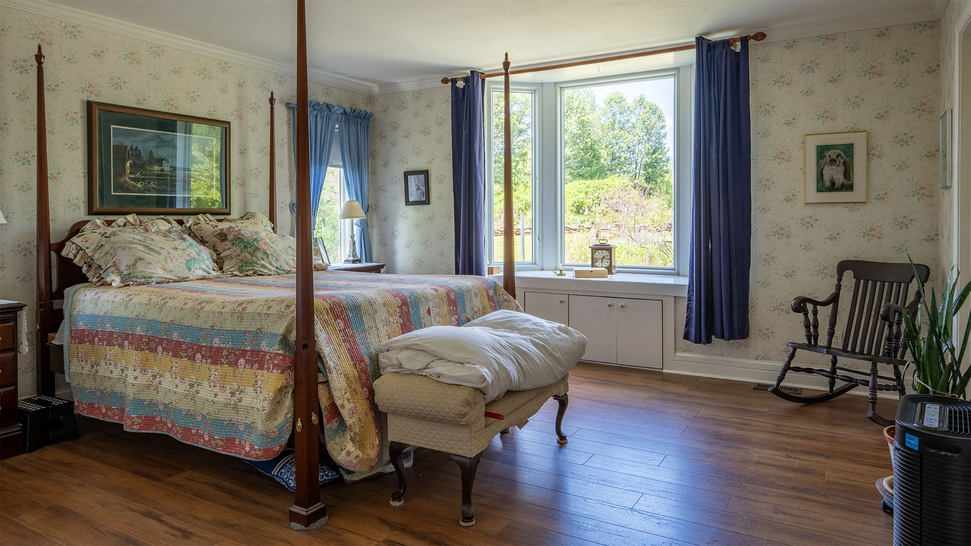 Primary bedroom at Asgardd Farm in Afton VA with large windows and peaceful garden views