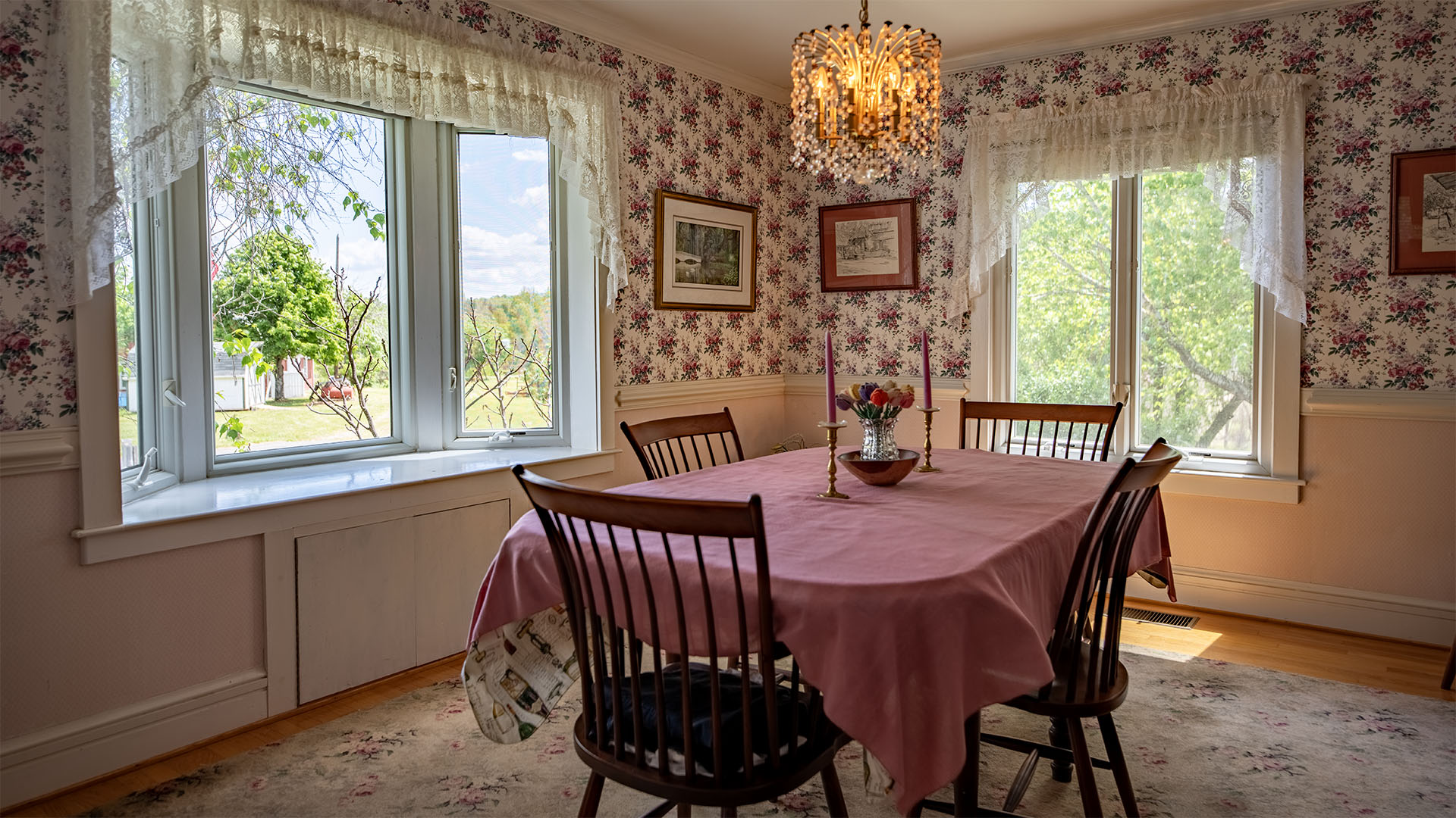 Dining room at Asgardd Farm near Greenwood in Afton VA with large windows, chandelier and countryside views