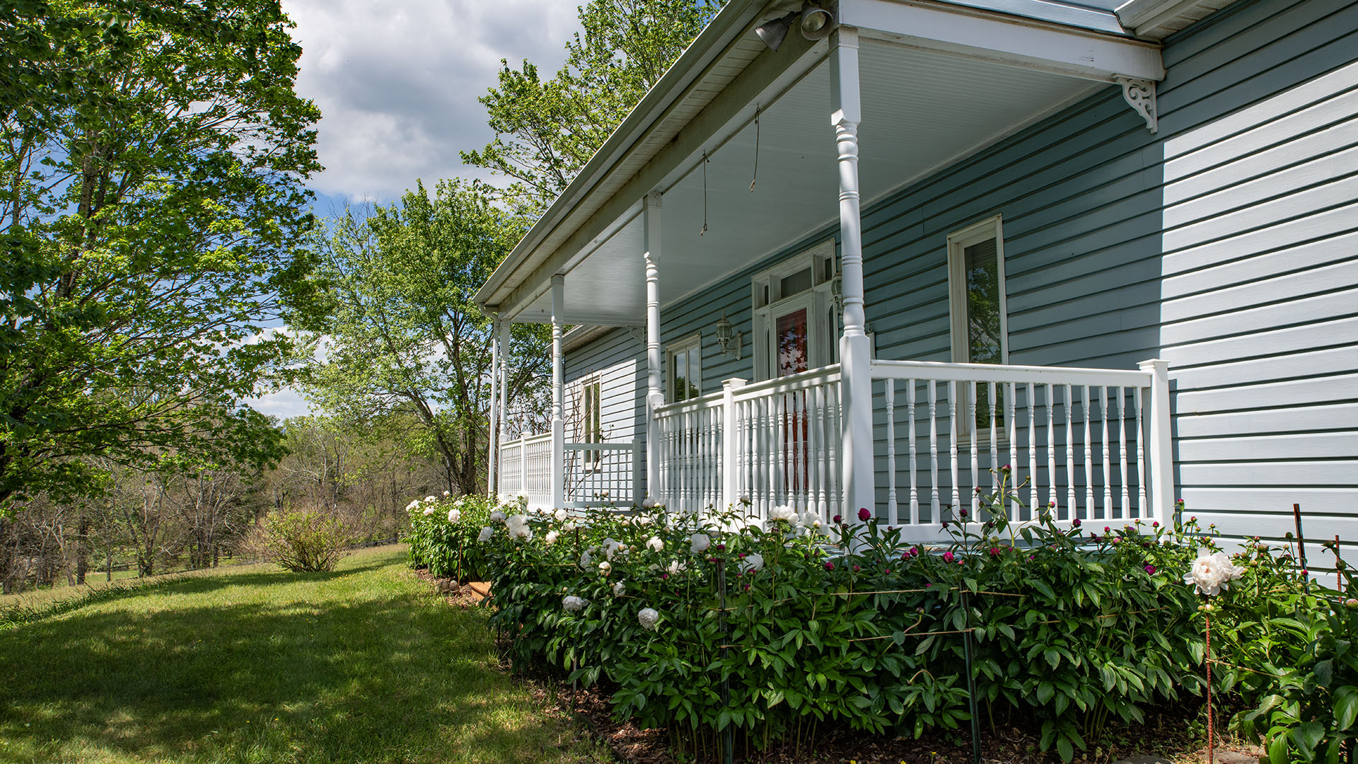 Asgardd Farm has beautiful peonies planted at its front porch