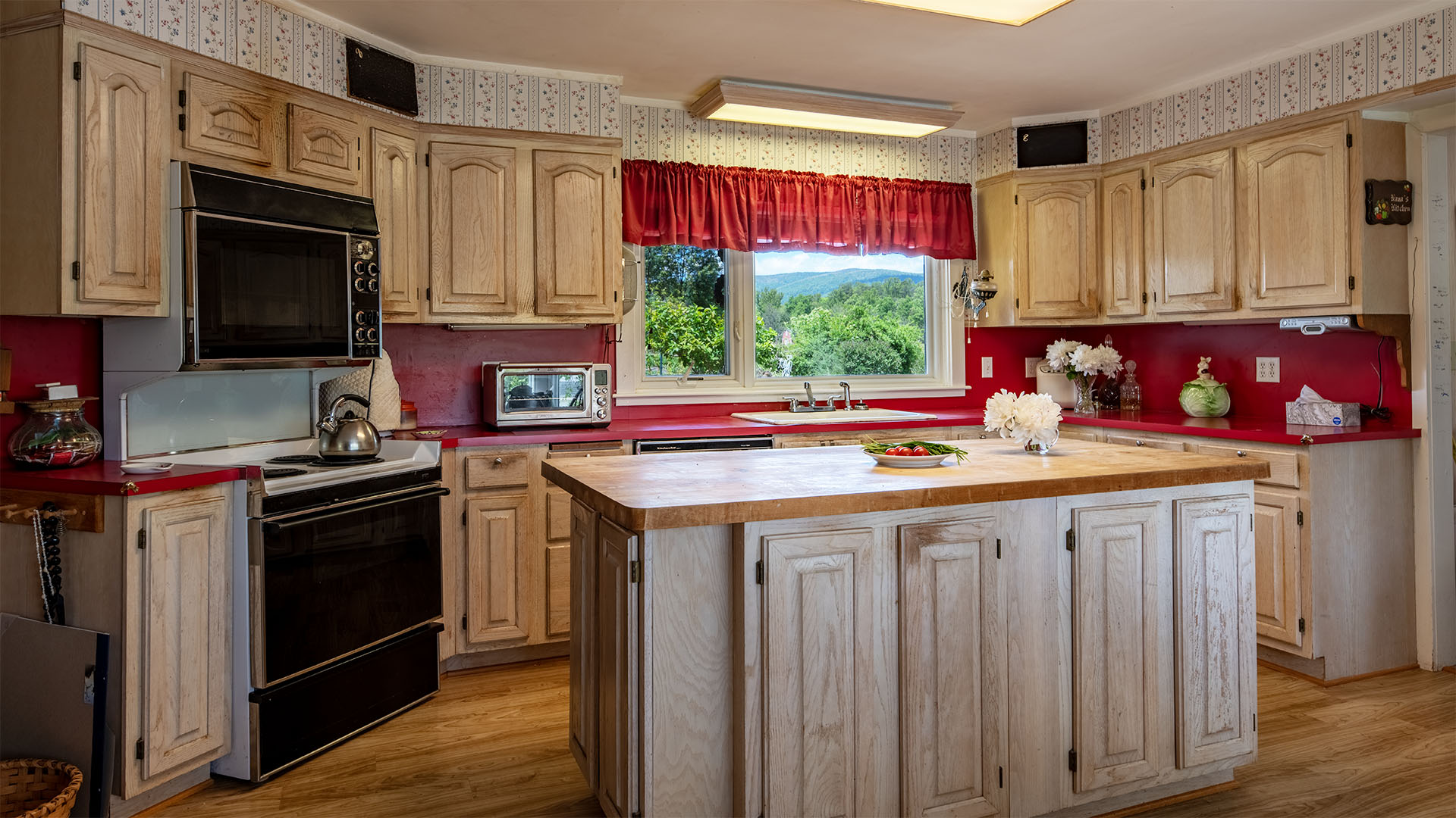 Kitchen at Asgardd Farm in Afton VA with farmhouse cabinetry, island and natural light