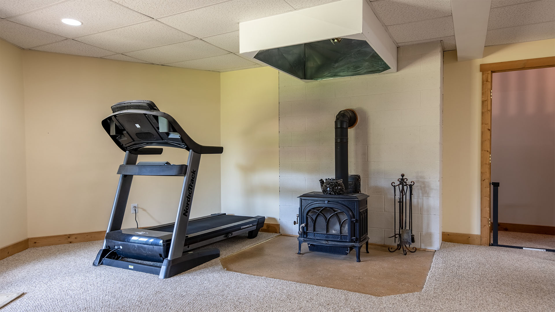 Finished basement recreational room with woodstove at 3638 Oak Park Road