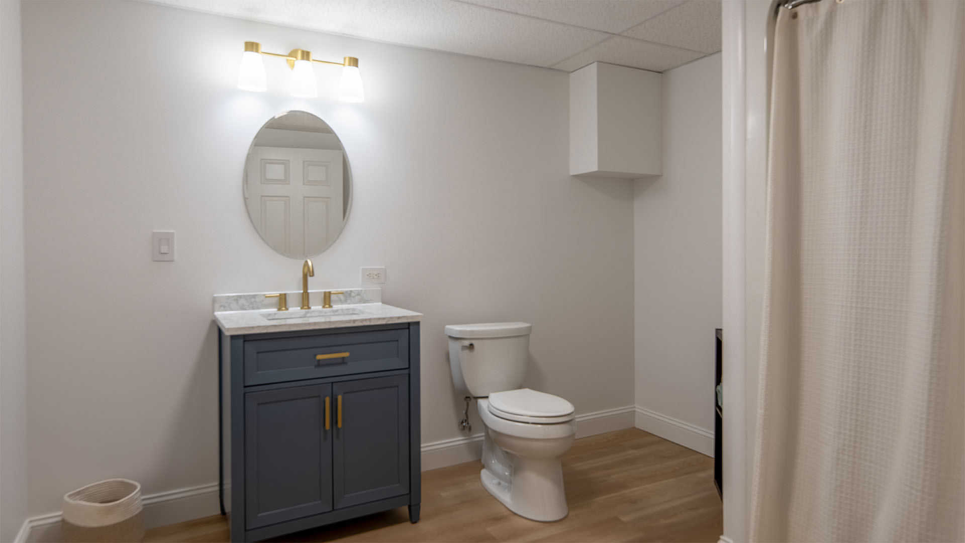 Full bathroom in the finished walkout basement of the Madison Virginia log home