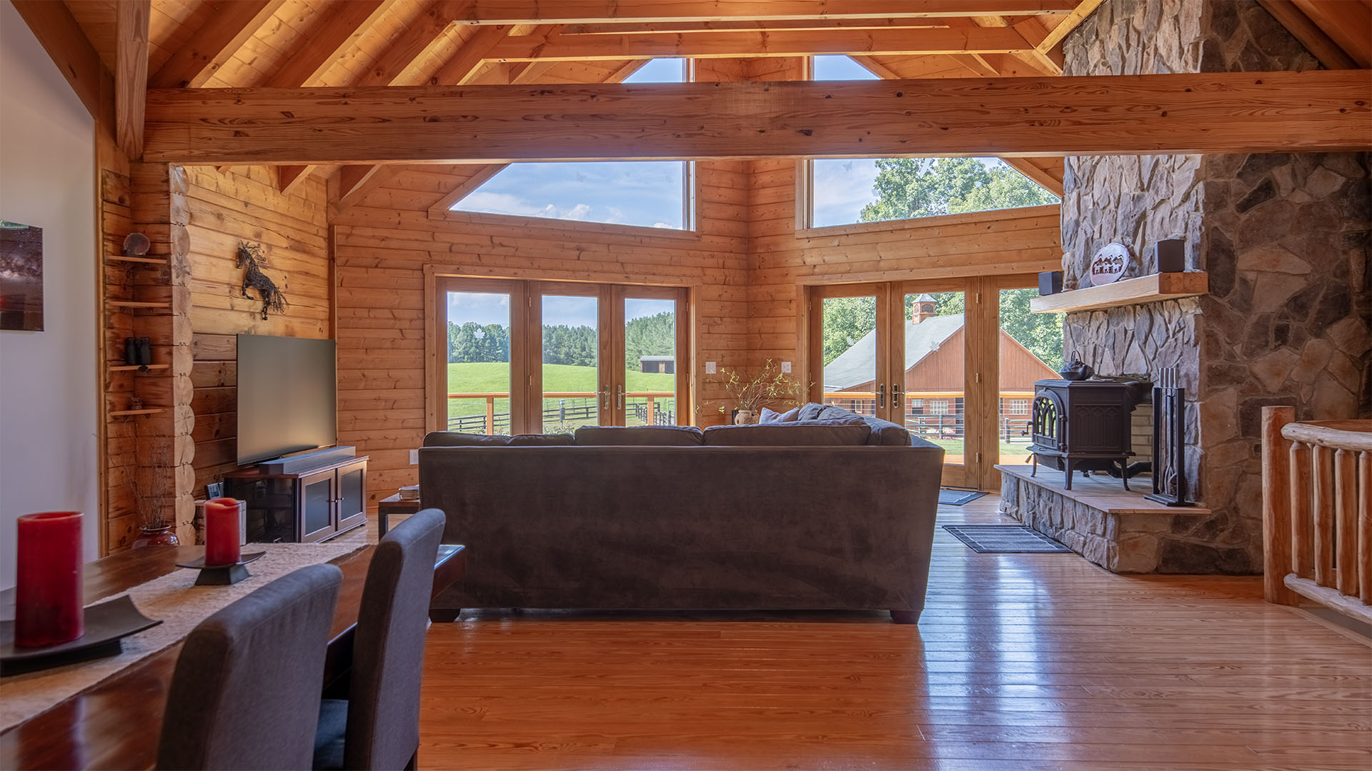 Log home great room with stone fireplace and woodstove in Madison Virginia