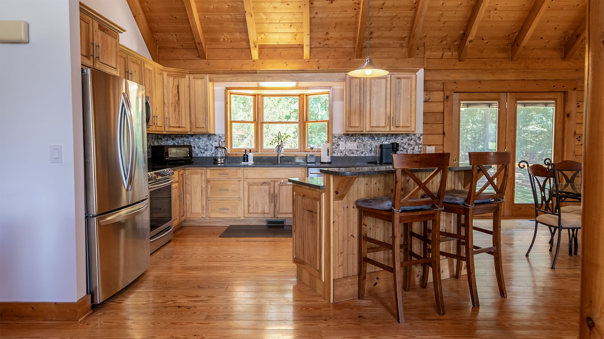 Kitchen in the log home on 44 acres at 3638 Oak Park Road in Madison Virginia