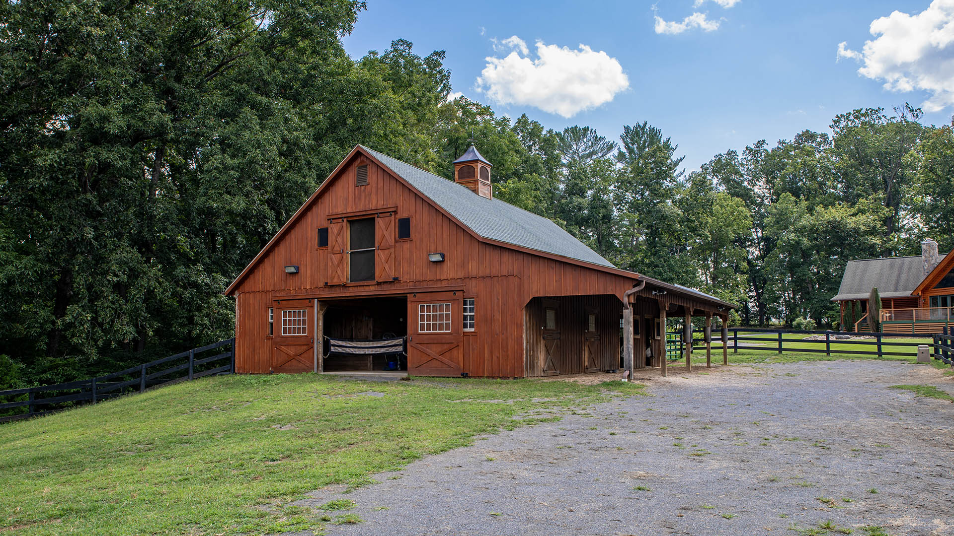 Horse stable and surrounding farm setting at 3638 Oak Park Road in Madison Virginia
